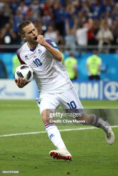 Gylfi Sigurdsson of Iceland celebrates after scoring a penalty for his team's first goal during the 2018 FIFA World Cup Russia group D match between...