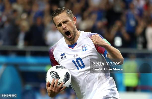 Gylfi Sigurdsson of Iceland celebrates after scoring a penalty for his team's first goal during the 2018 FIFA World Cup Russia group D match between...