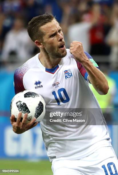 Gylfi Sigurdsson of Iceland celebrates after scoring a penalty for his team's first goal during the 2018 FIFA World Cup Russia group D match between...