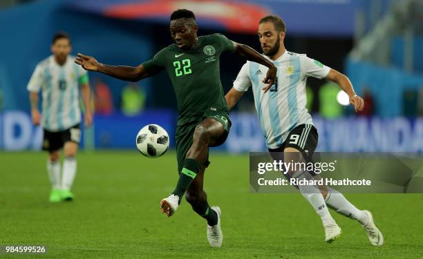 Kenneth Omeruo of Nigeria is challenged by Gonzalo Higuain of Argentina during the 2018 FIFA World Cup Russia group D match between Nigeria and...