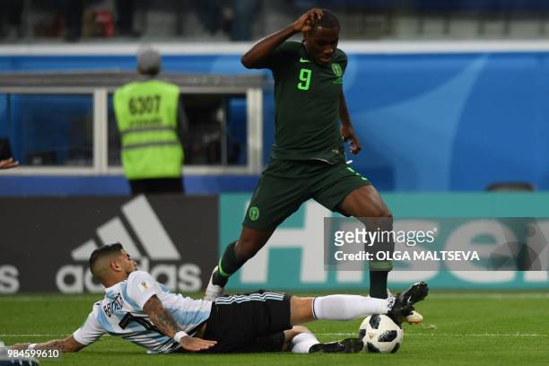 Argentina's midfielder Ever Banega and Nigeria's forward Odion Jude Ighalo compete for the ball during the Russia 2018 World Cup Group D football...