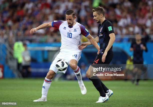 Gylfi Sigurdsson of Iceland and Filip Bradaric of Croatia in action during the 2018 FIFA World Cup Russia group D match between Iceland and Croatia...