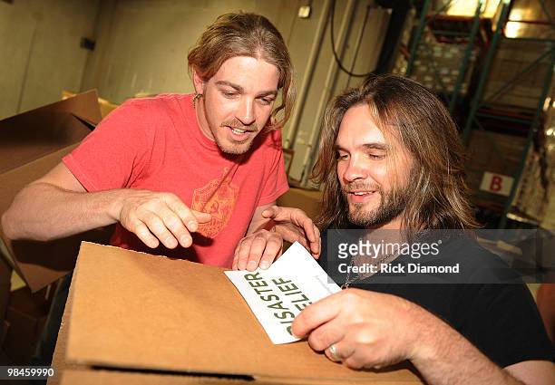 Former American Idol's Bucky Covington and Bo Bice participate in the "Idol Gives Back" Volunteer Program at the Second Harvest Food Bank of Middle...