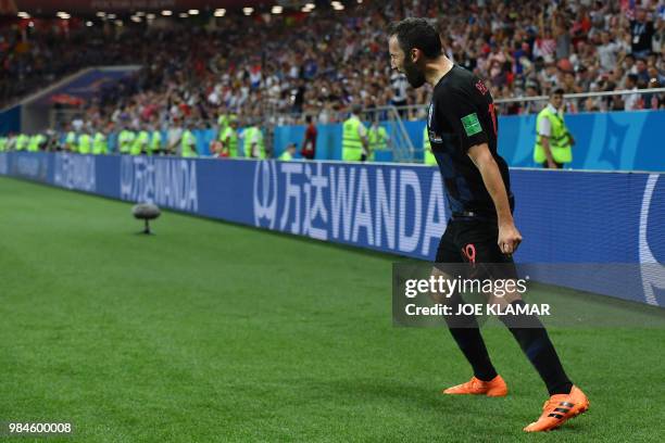 Croatia's midfielder Milan Badelj celebrates after scoring the opening goal during the Russia 2018 World Cup Group D football match between Iceland...