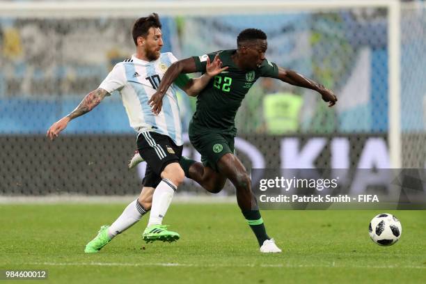 Lionel Messi of Argentina tackles Kenneth Omeruo of Nigeria during the 2018 FIFA World Cup Russia group D match between Nigeria and Argentina at...