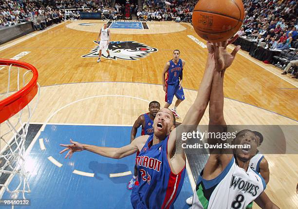 Tayshaun Prince of the Detroit Pistons battles for the rebound against Ryan Gomes of the Minnesota Timberwolves during the game on April 14, 2010 at...