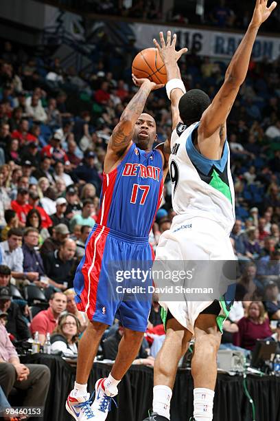 Chucky Atkins of the Detroit Pistons goes up for a shot against Wayne Ellington of the Minnesota Timberwolves during the game on April 14, 2010 at...