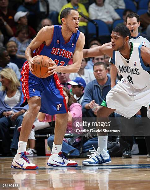 Tayshaun Prince of the Detroit Pistons looks to move the ball against Ryan Gomes of the Minnesota Timberwolves during the game on April 14, 2010 at...