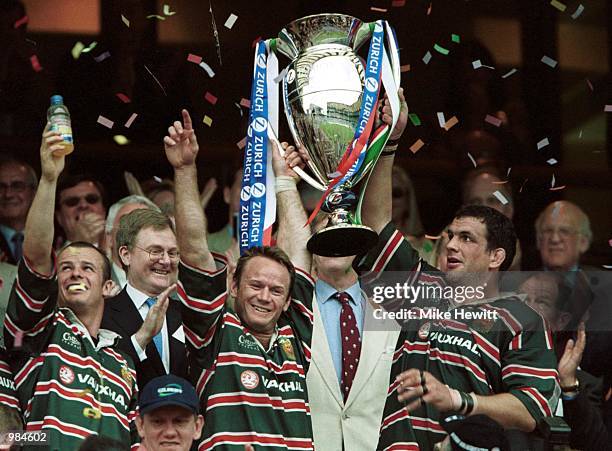 Captain Martin Johnson and Pat Howard of Leicester lift the Championship Trophy during the match between Bath and Leicester Tigers in the Zurich...