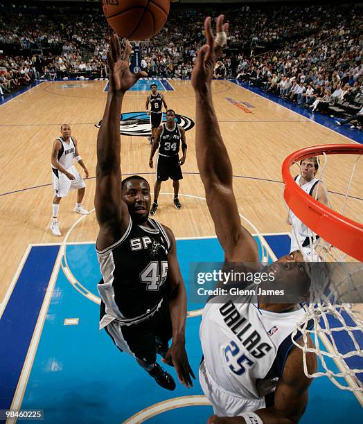 DeJuan Blair of the San Antonio Spurs goes up for the layup against Erick Dampier of the Dallas Mavericks during a game at the American Airlines...
