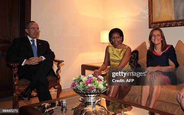 First Lady Michelle Obama talks with Mexican President Felipe Calderon and Mexican firts Lady Margarita Zavala at Los Pinos presidential house in...