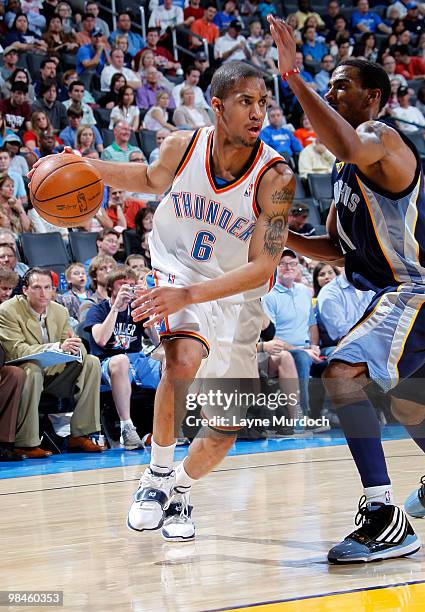 Eric Maynor of the Oklahoma City Thunder drives past Mike Conley of the Memphis Grizzlies on April 14, 2010 at the Ford Center in Oklahoma City,...