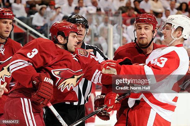 Keith Yandle of the Phoenix Coyotes and Darren Helm of the Detroit Red Wings have words after a whistle in Game One of the Western Conference...