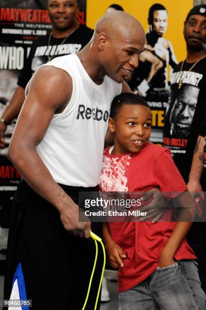 Boxer Floyd Mayweather Jr. Hugs his son Koraun Mayweather during a workout April 14, 2010 in Las Vegas, Nevada. Mayweather is scheduled to face Shane...