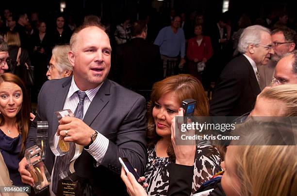 Garth Brooks speaks with reporters after the GRAMMYs on the Hill awards at The Liaison Capitol Hill Hotel on April 14, 2010 in Washington, DC.