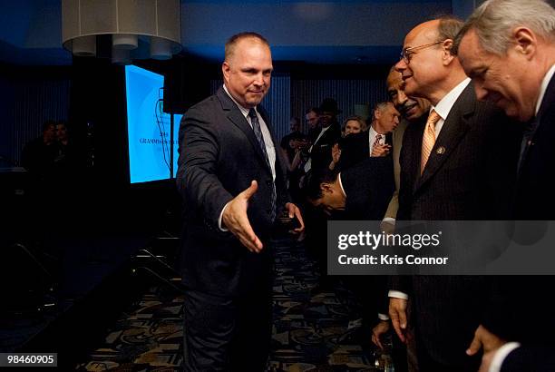 Garth Brooks shakes hands with congress members during the GRAMMYs on the Hill awards at The Liaison Capitol Hill Hotel on April 14, 2010 in...