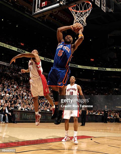 Bill Walker of the New York Knicks goes in for the dunk past Jarrett Jack of the Toronto Raptors during a game on April 14, 2010 at the Air Canada...