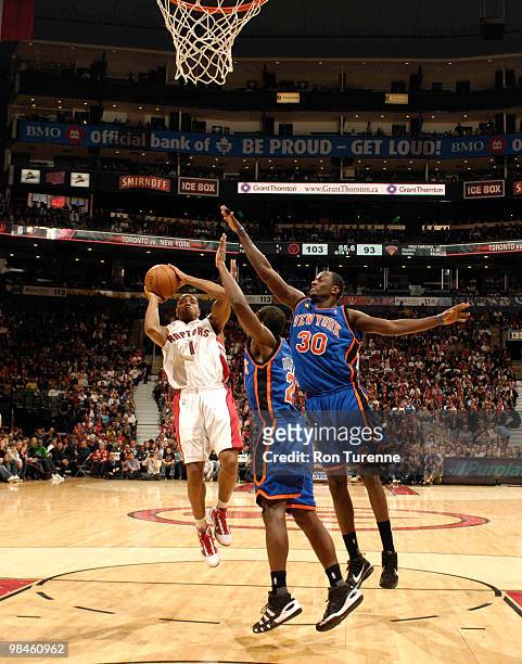 Jarrett Jack of the Toronto Raptors takes the step-back jumper over Earl Barron of the New York Knicks during a game on April 14, 2010 at the Air...