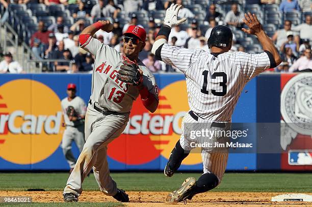 Alex Rodriguez of the New York Yankees is forced out at second base as Maicer Izturis of the Los Angeles Angels of Anaheim attempts a double play in...