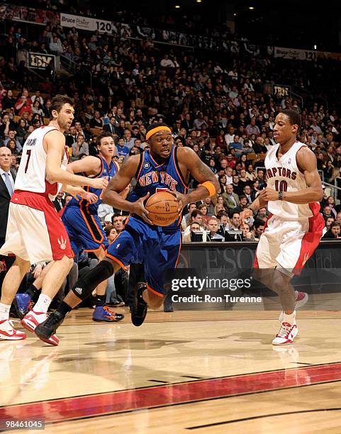 Bill Walker of the New York Knicks slashes to the basket past DeMar DeRozan of the Toronto Raptors during a game on April 14, 2010 at the Air Canada...