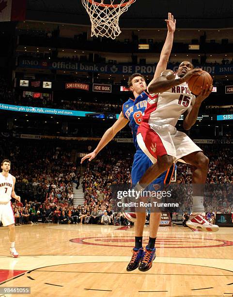 Amir Johnson of the Toronto Raptors drives the lane for the layup ahead of Danilo Gallinari of the New York Knicks during a game on April 14, 2010 at...