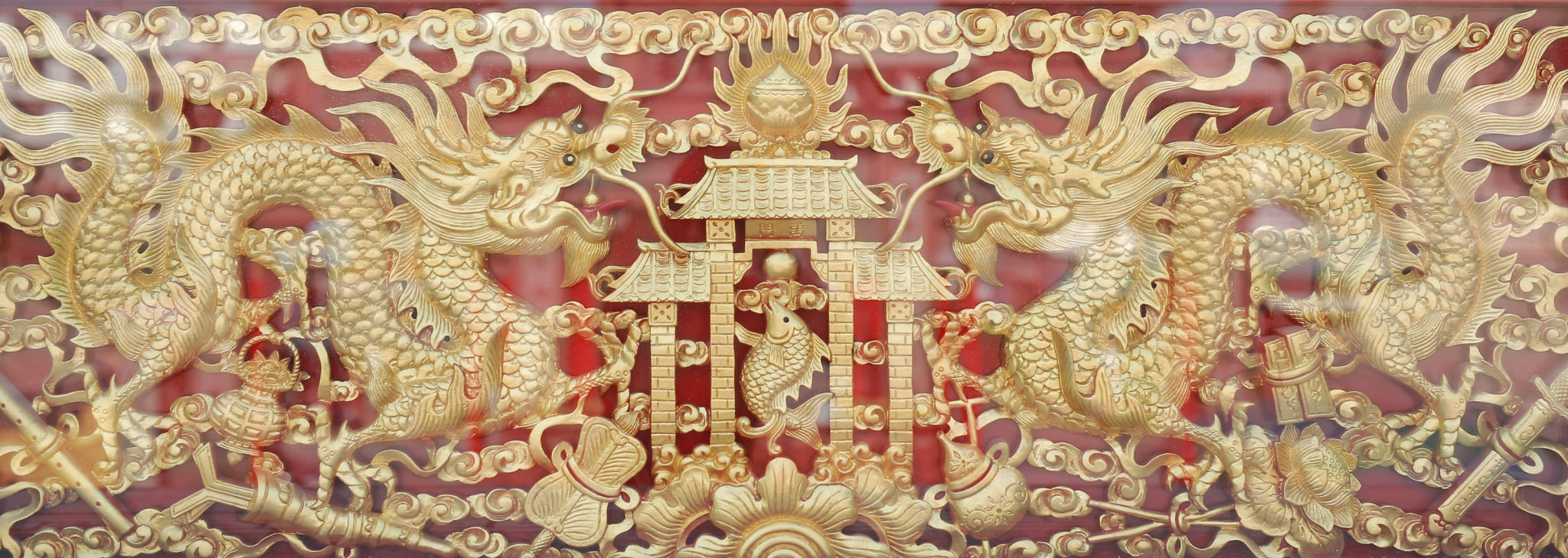 Traditional golden chinese dragon wood carved with mirror reflect. Traditional golden chinese dragon wood carved with mirror reflect.