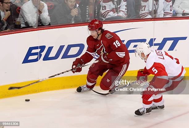 Shane Doan of the Phoenix Coyotes skates with the puck past Nicklas Lidstrom of the Detroit Red Wings in the second period of Game One of the Western...