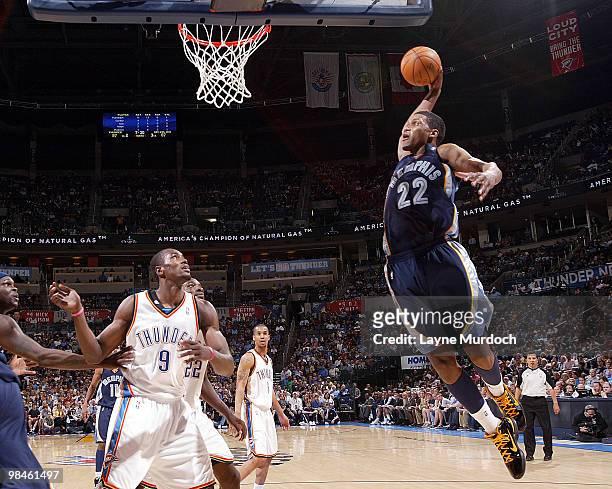 Rudy Gay of the Memphis Grizzlies dunks the ball over Serge Ibaka of the Oklahoma City Thunder on April 14, 2010 at the Ford Center in Oklahoma City,...