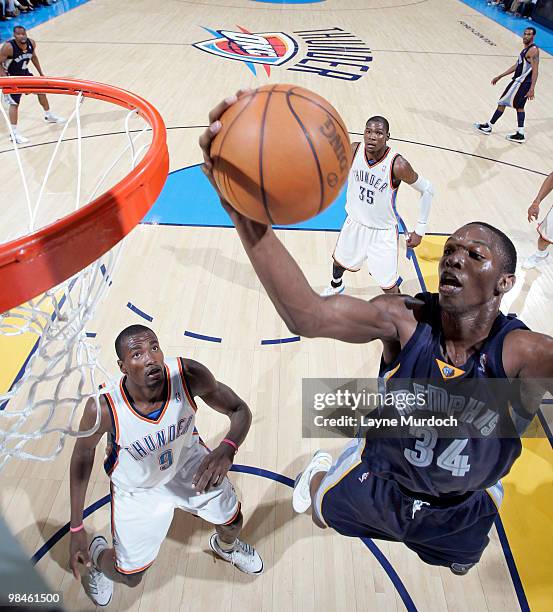 Hasheem Thabeet of the Memphis Grizzlies drives one to the basket and dunks against Serge Ibaka of the Oklahoma City Thunder on April 14, 2010 at the...