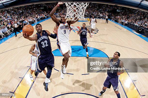 Mayo of the Memphis Grizzlies goes for the layup by Serge Ibaka of the Oklahoma City Thunder on April 14, 2010 at the Ford Center in Oklahoma City,...