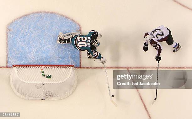 Evgeni Nabokov of the San Jose Sharks defends against Milan Hejduk of the Colorado Avalanche in Game One of the Western Conference Quarterfinals...