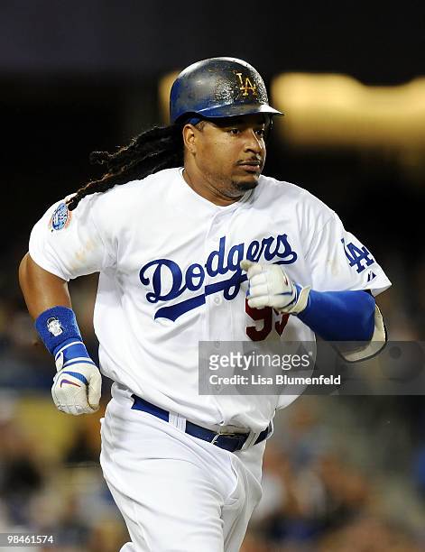 Manny Ramirez of the Los Angeles Dodgers runs to first base after hitting a RBI single in the third inning against the Arizona Diamondbacks at Dodger...