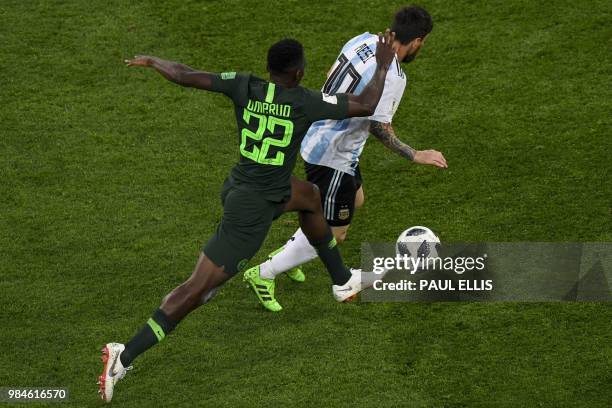 Argentina's forward Lionel Messi is marked by Nigeria's defender Kenneth Omeruo during the Russia 2018 World Cup Group D football match between...