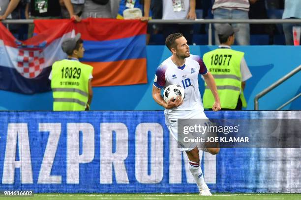 Iceland's midfielder Gylfi Sigurdsson celebrates after scoring a goal during the Russia 2018 World Cup Group D football match between Iceland and...