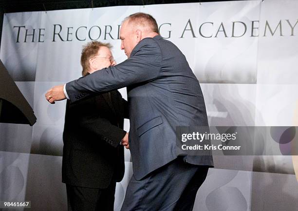 Paul Williams and Garth Brooks hug during the GRAMMYs on the Hill awards at The Liaison Capitol Hill Hotel on April 14, 2010 in Washington, DC.