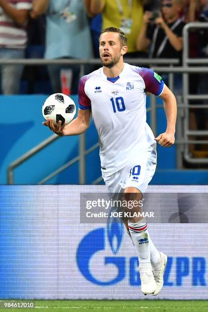 Iceland's midfielder Gylfi Sigurdsson celebrates after scoring a goal during the Russia 2018 World Cup Group D football match between Iceland and...