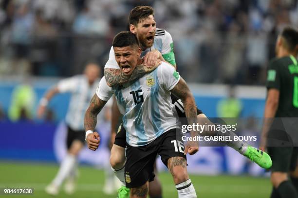 Argentina's defender Marcos Rojo celebrates his goal with Argentina's forward Lionel Messi during the Russia 2018 World Cup Group D football match...