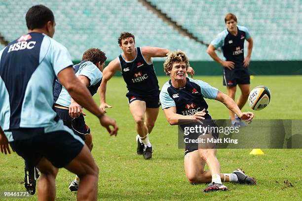 Berrick Barnes passes the ball during a Waratahs Super 14 training session at the Sydney Football Stadium on April 15, 2010 in Sydney, Australia.