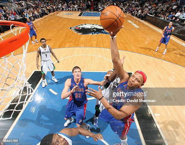 Charlie Villanueva of the Detroit Pistons puts up a shot against Ryan Gomes and Corey Brewer Minnesota Timberwolves during the game on April 14, 2010...