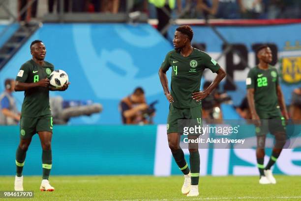 Oghenekaro Etebo, Wilfred Ndidi and Kenneth Omeruo of Nigeria stand dejected during the 2018 FIFA World Cup Russia group D match between Nigeria and...