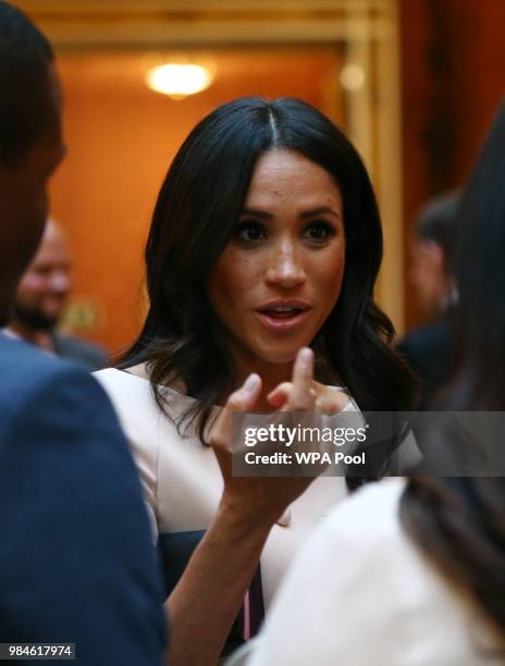 Meghan, Duchess of Sussex meets group of leaders during the Queen's Young Leaders Awards Ceremony at Buckingham Palace on June 26, 2018 in London,...