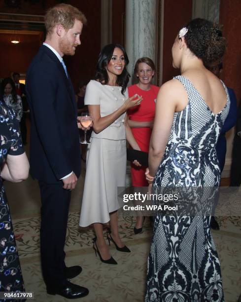 Meghan, Duchess of Sussex and Prince Harry, Duke of Sussex meet group of leaders during the Queen's Young Leaders Awards Ceremony at Buckingham...