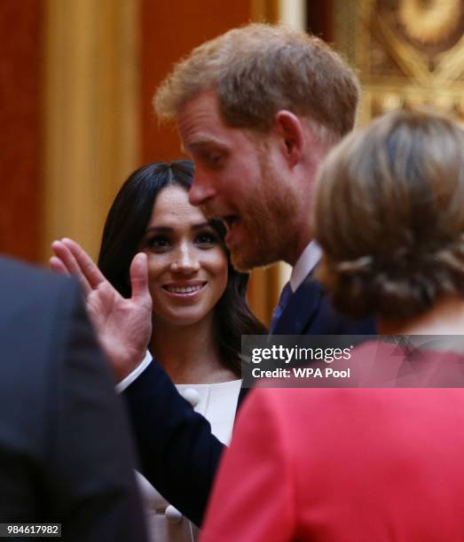 Meghan, Duchess of Sussex and Prince Harry, Duke of Sussex meet group of leaders during the Queen's Young Leaders Awards Ceremony at Buckingham...