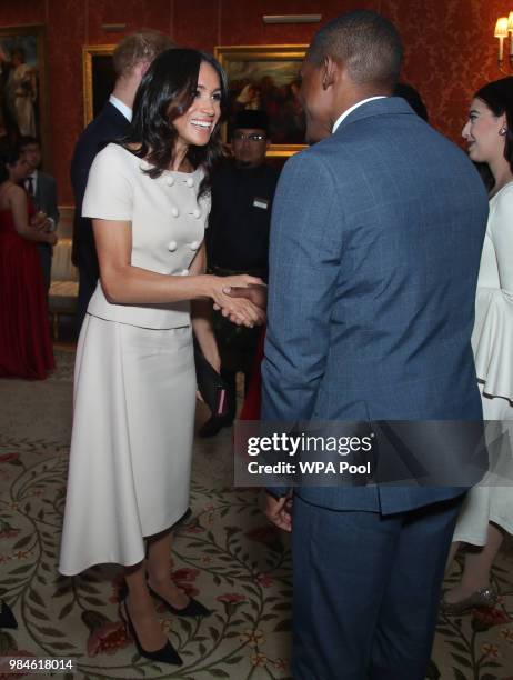 Meghan, Duchess of Sussex meets group of leaders during the Queen's Young Leaders Awards Ceremony at Buckingham Palace on June 26, 2018 in London,...