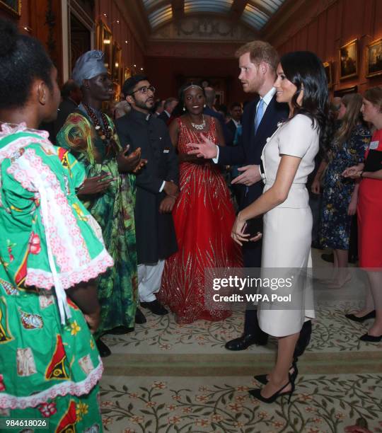 Meghan, Duchess of Sussex and Prince Harry, Duke of Sussex meet group of leaders during the Queen's Young Leaders Awards Ceremony at Buckingham...