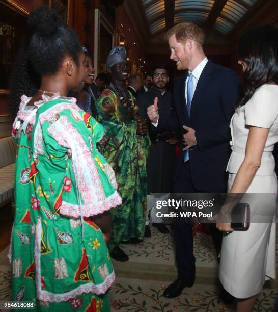 Meghan, Duchess of Sussex and Prince Harry, Duke of Sussex meet group of leaders during the Queen's Young Leaders Awards Ceremony at Buckingham...