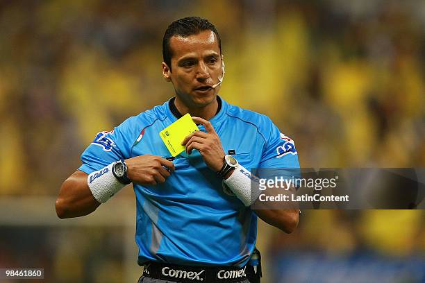 Mexican referee Miguel Angel Flores in action during a match between America and Pumas as part of the 2010 Bicentenary Tournament at Azteca Stadium...