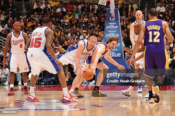 Steve Blake of the Los Angeles Clippers battles for a loose ball against Pau Gasol of the Los Angeles Lakers at Staples Center on April 14, 2010 in...