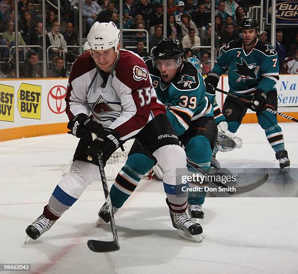 Cody McLeod of the Colorado Avalanche, battles in the corner with Logan Couture of the San Jose Sharks in Game One of the Western Conference...