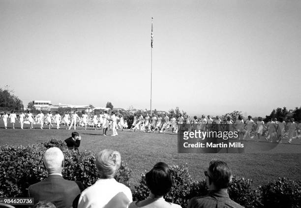 Children dance around during May Day at John Thomas Dye elementary school on May 1, 1967 in Los Angeles, California. May Day is a public holiday...
